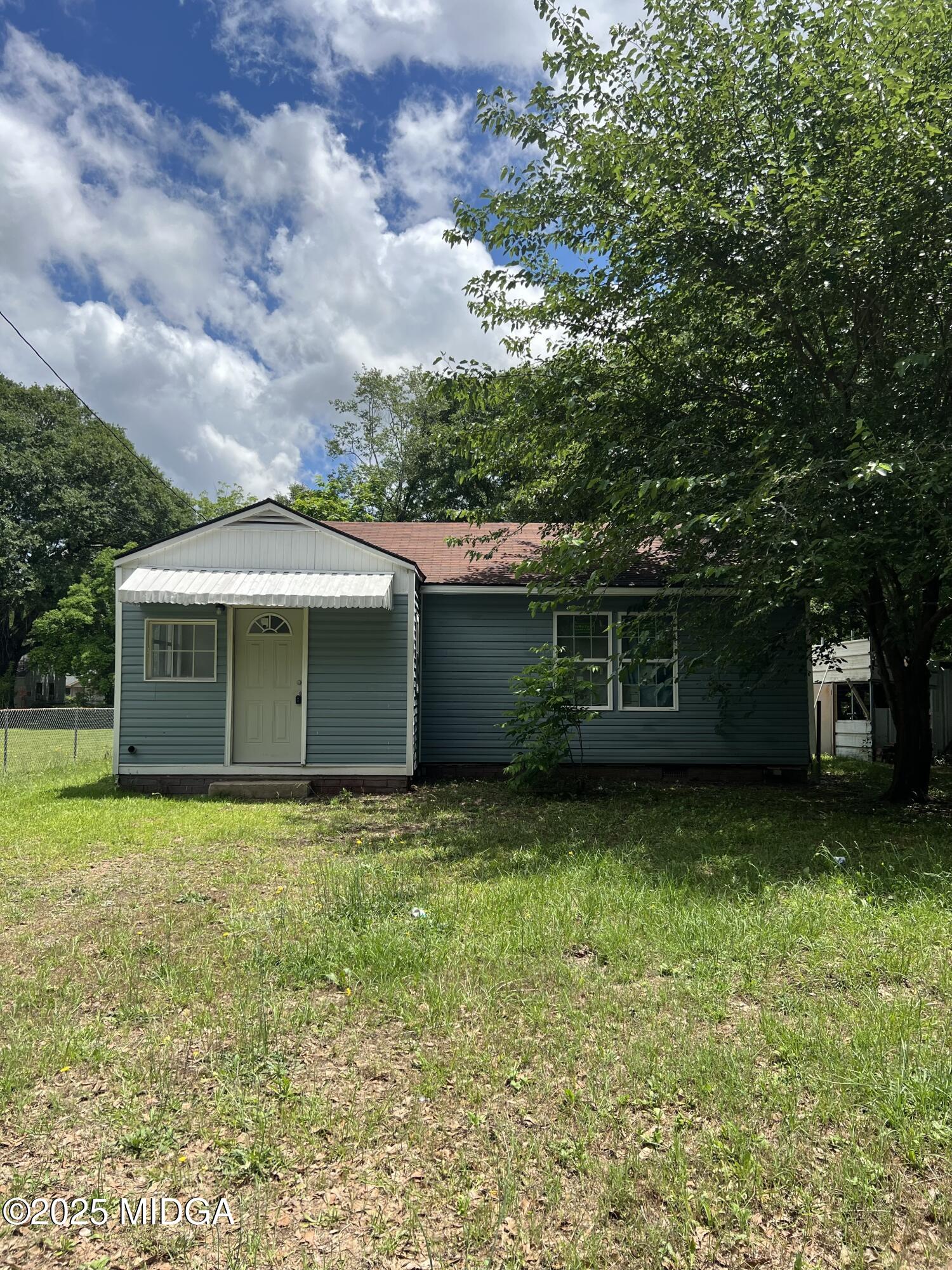 a front view of a house with garden
