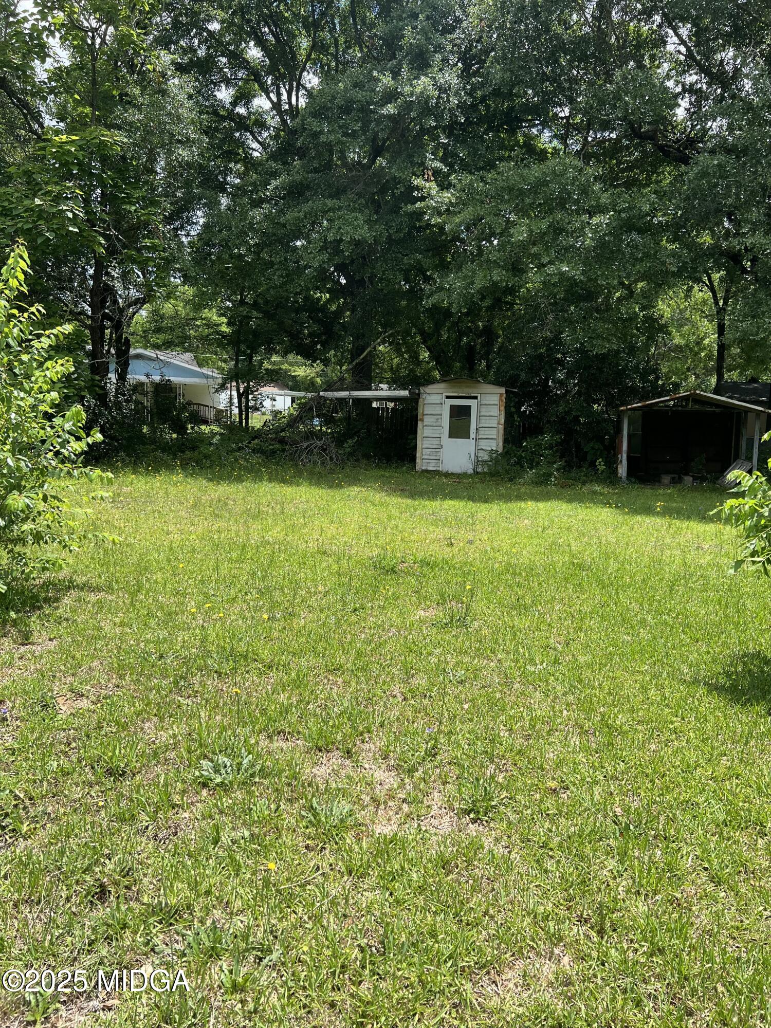 101 Jacobs Lane Warner Robins, GA 31093 - Photo 16 of 18 a view of a backyard with a garden