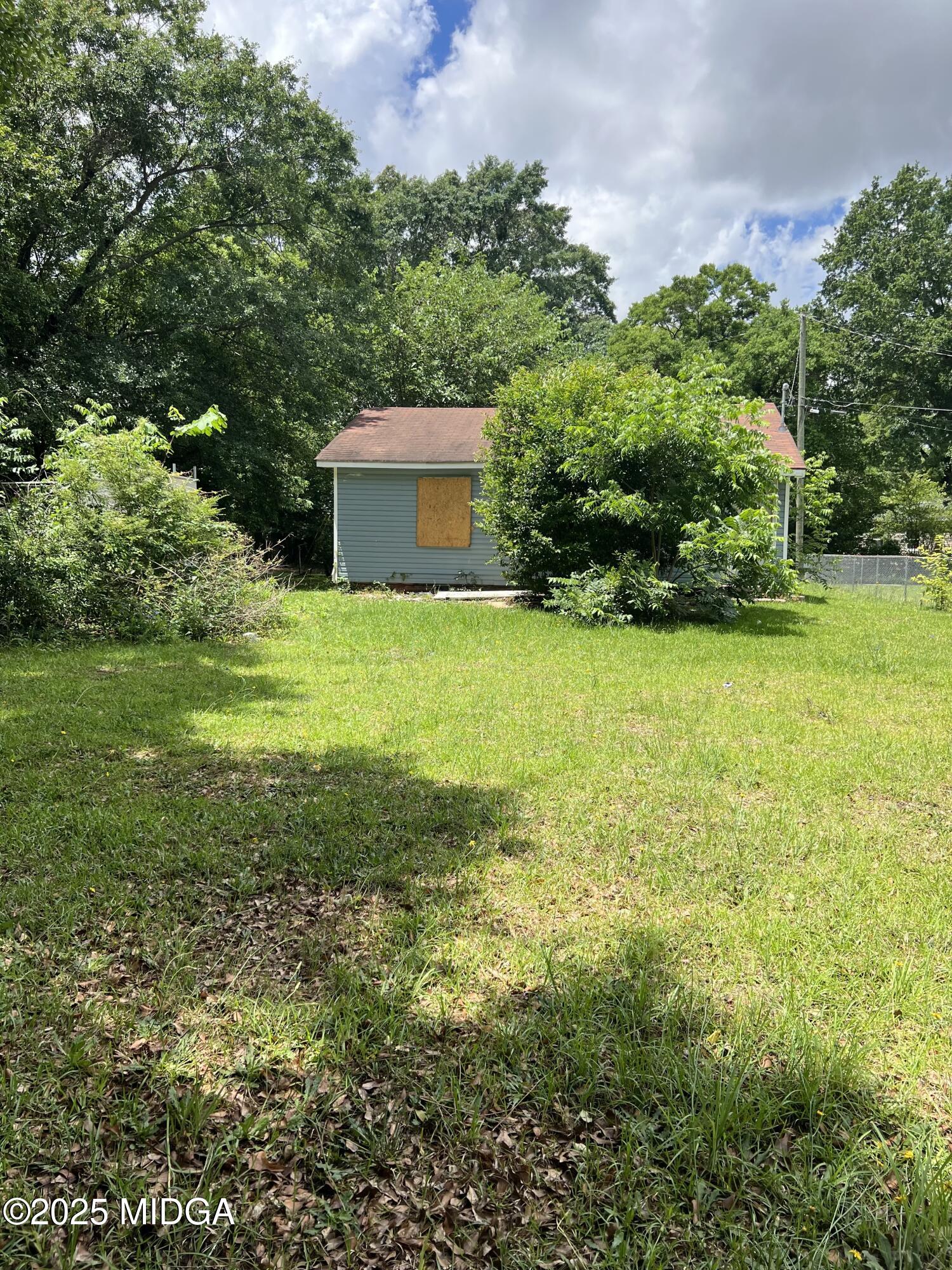 101 Jacobs Lane Warner Robins, GA 31093 - Photo 17 of 18 a view of a garden with a building in the background