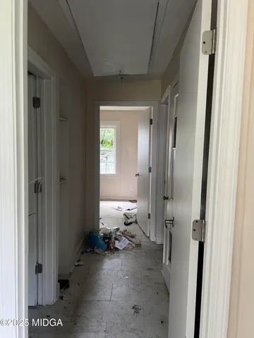 a room with a bed and a mirror