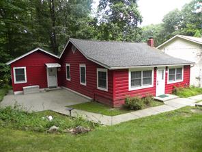 10 Bainbridge Road Cortlandt Manor, NY 10567 - Photo 1 of 1 a front view of a house with garden