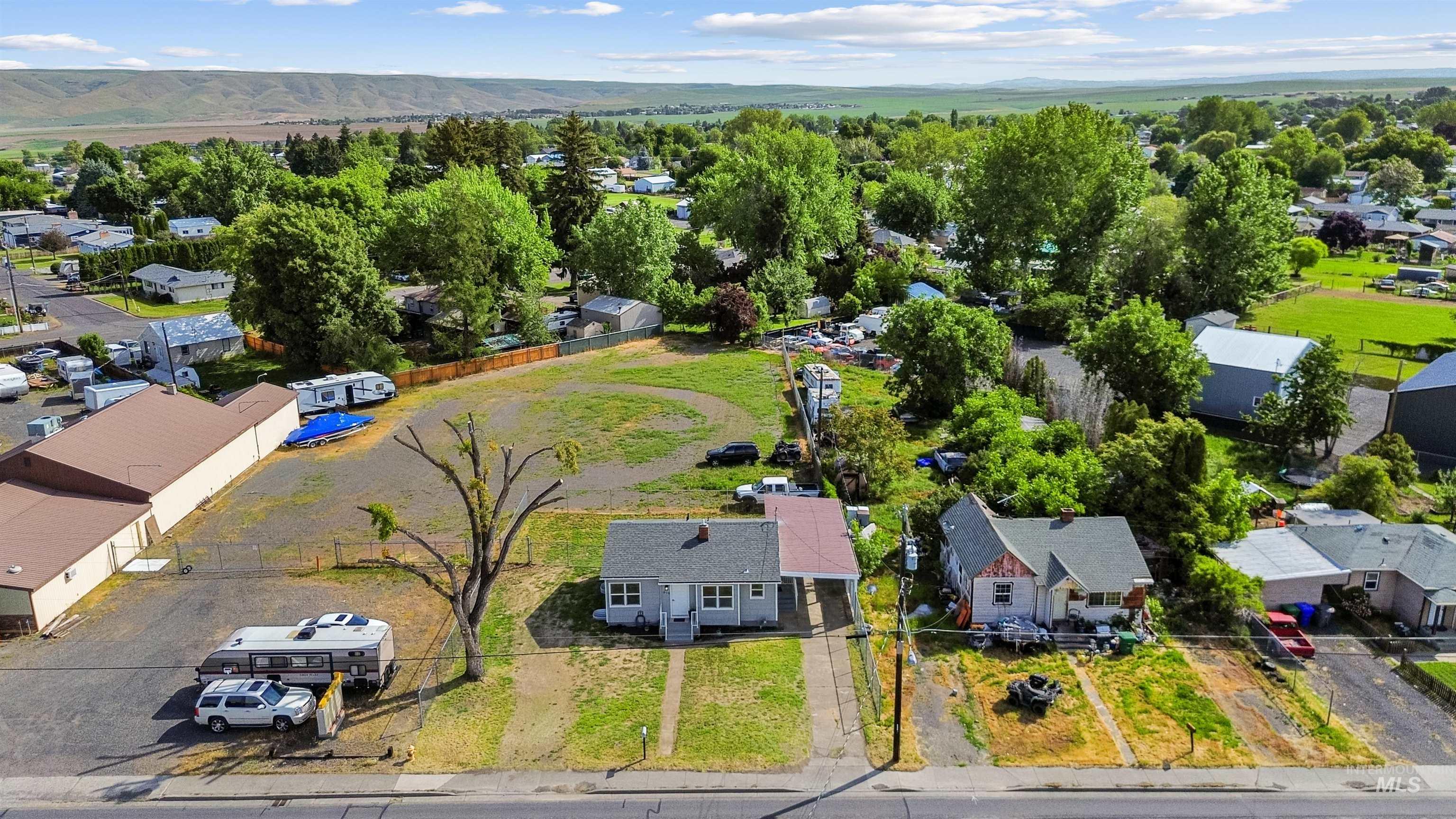 619 Thain Road Lewiston, ID 83501 - Photo 34 of 44 Residential lot featuring established trees, a clear parcel, and a paved street frontage