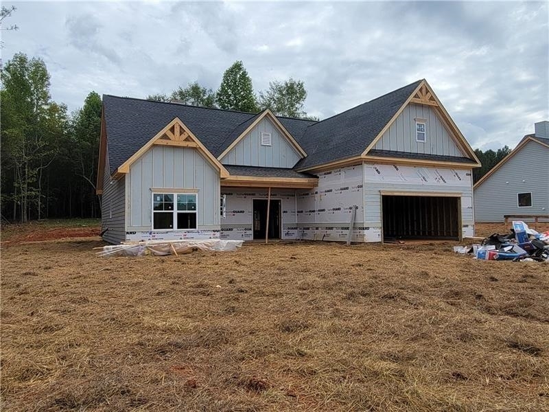 591 Maddox Road, Unit 2 Winder, GA 30680 - Photo 1 of 1 a front view of a house with a yard and garage