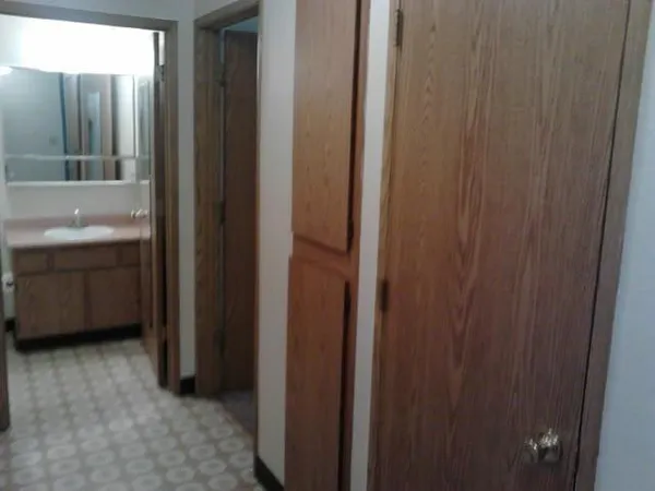 a bathroom with a sink a mirror and a shower