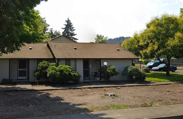 front view of a house with a yard