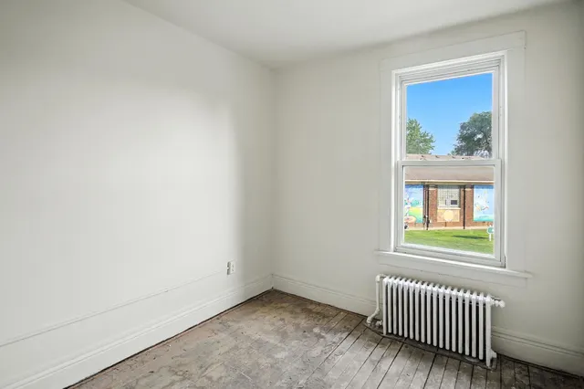 a kitchen with a stove a sink and a refrigerator