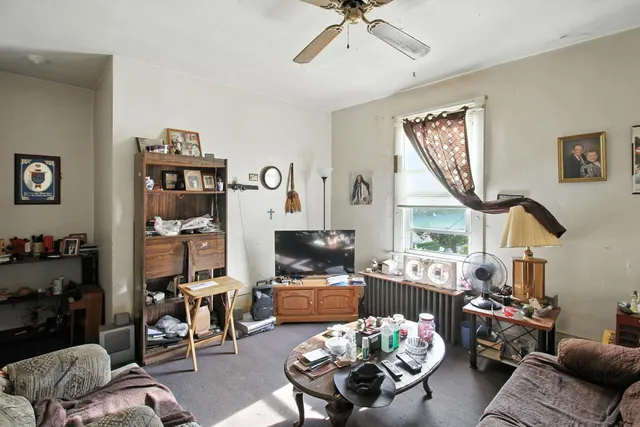 a living room with furniture or couch and a window