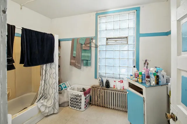 a bedroom with furniture and a window