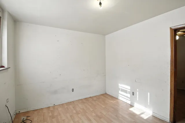 a view of a kitchen with a stove cabinets and a wooden floor