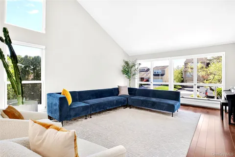 a living room with couch and a large window