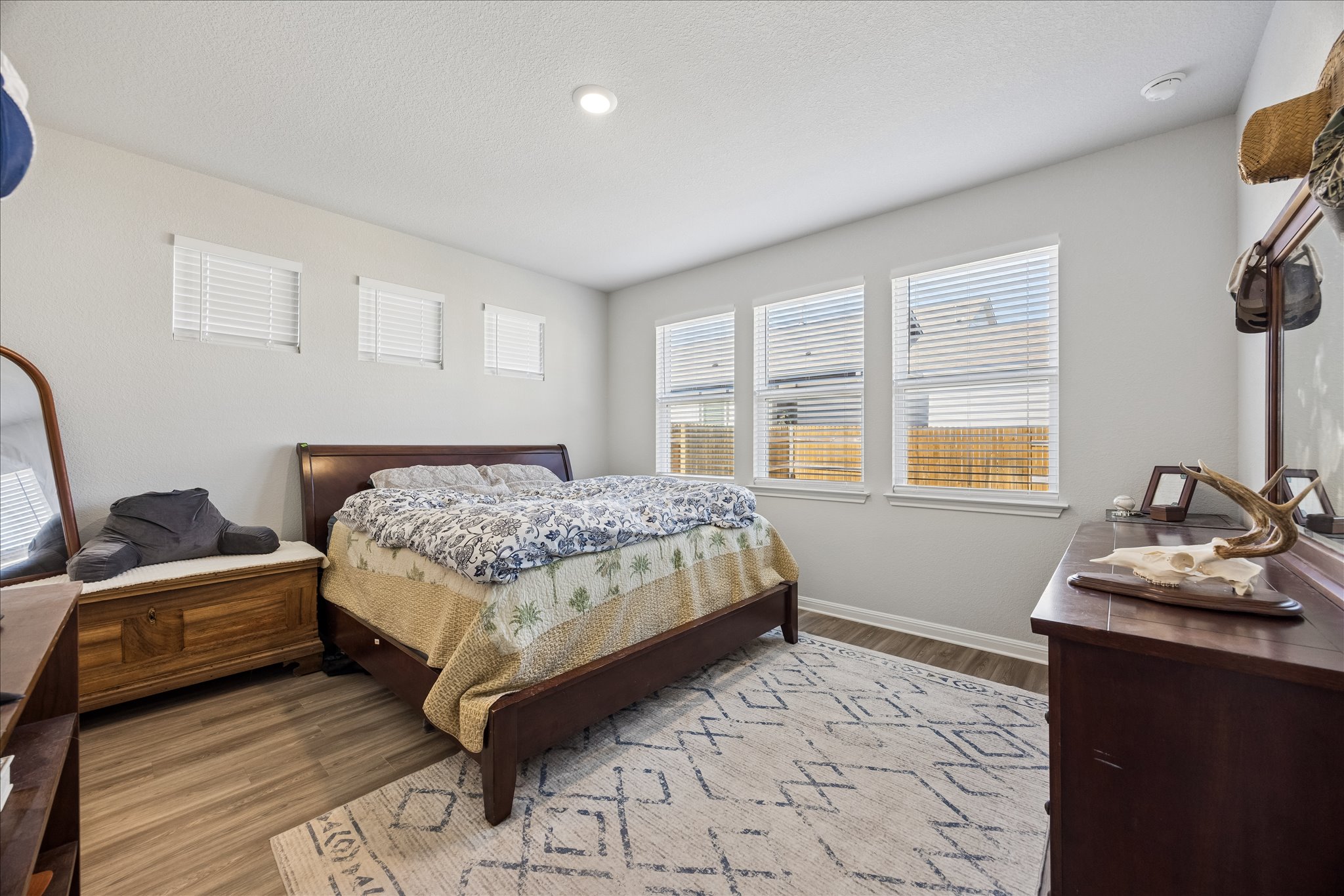 8300 Augeron Drive Austin, TX 78747 - Photo 9 of 16 Bedroom with light wood-style floors and baseboards