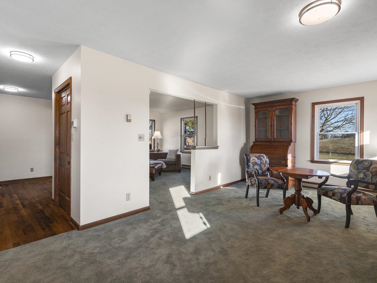 7101 Lawrenceville Road Garden Prairie, IL 61038 - Photo 13 of 53 a living room with furniture and a dining table