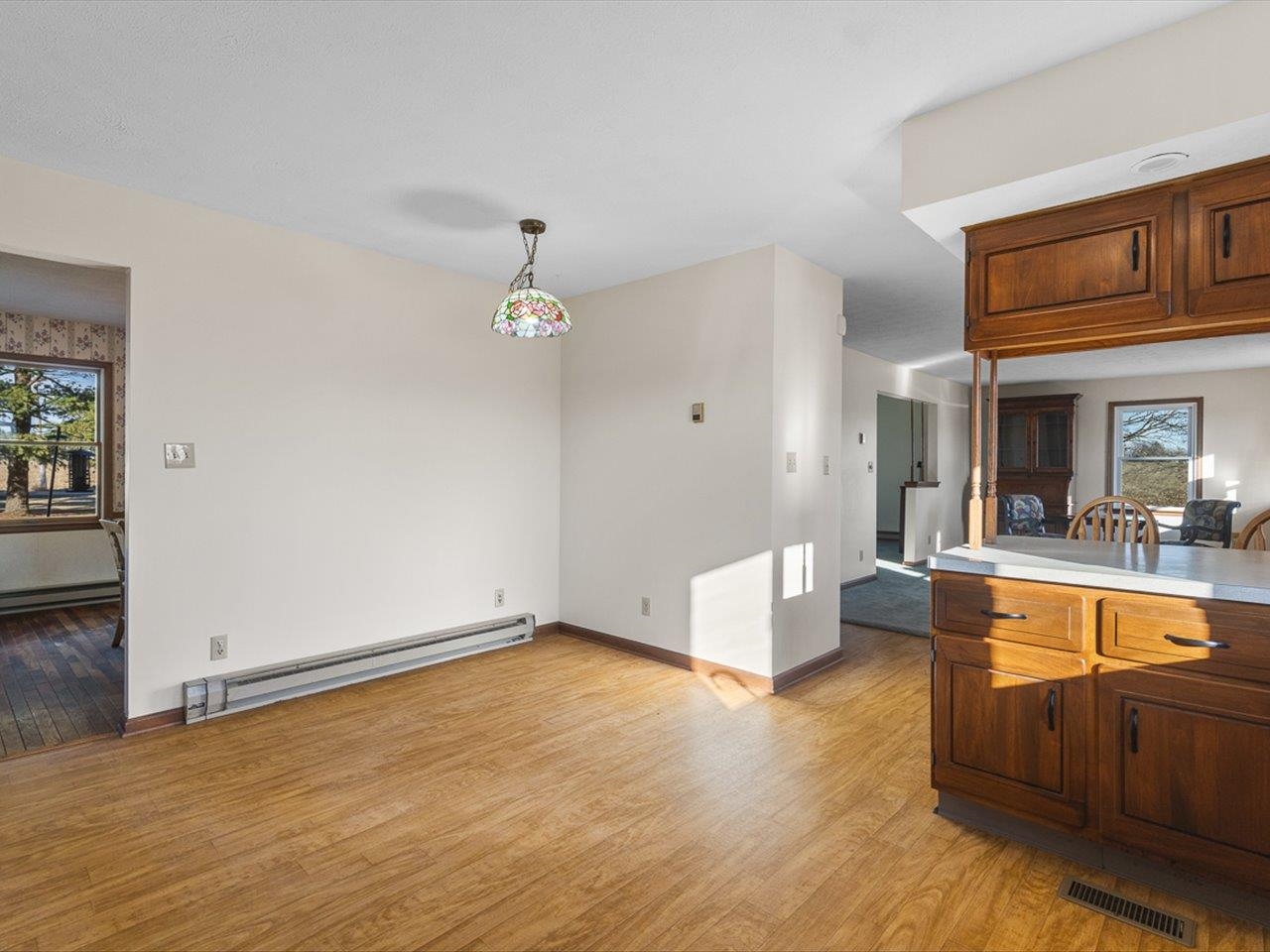 7101 Lawrenceville Road Garden Prairie, IL 61038 - Photo 17 of 53 a living room with couches and kitchen view with wooden floor