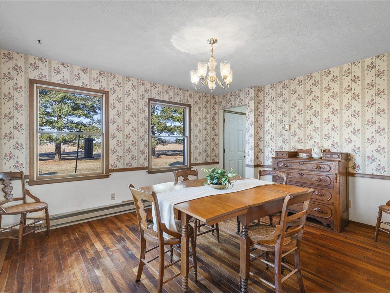7101 Lawrenceville Road Garden Prairie, IL 61038 - Photo 18 of 53 a view of a dining room with furniture and wooden floor
