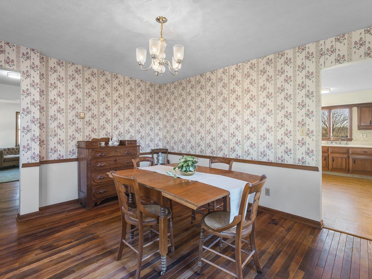 7101 Lawrenceville Road Garden Prairie, IL 61038 - Photo 19 of 53 a view of a dining room with furniture and wooden floor