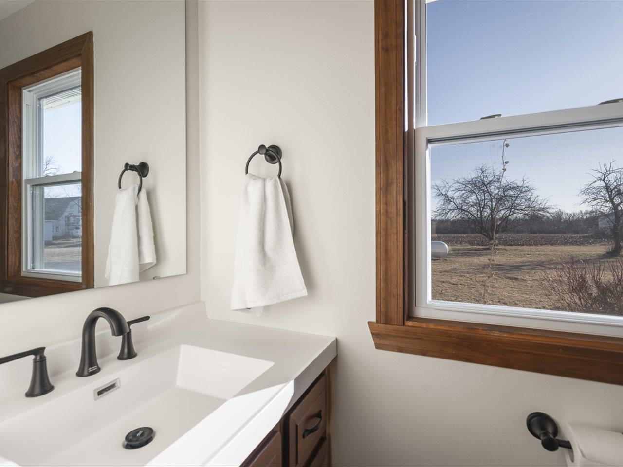 7101 Lawrenceville Road Garden Prairie, IL 61038 - Photo 21 of 53 a bathroom with a sink and a mirror