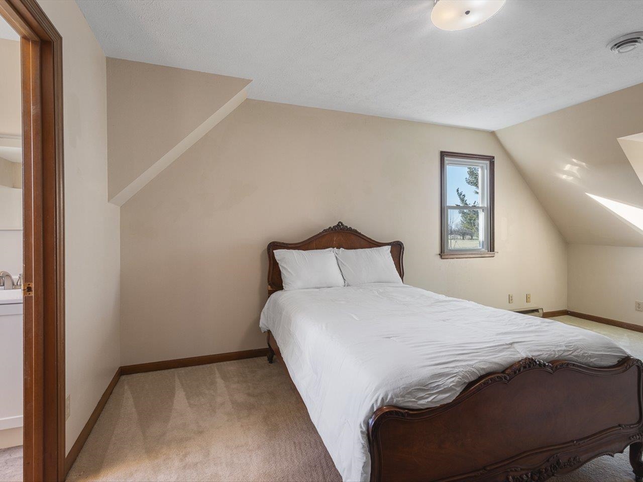 7101 Lawrenceville Road Garden Prairie, IL 61038 - Photo 27 of 53 a bedroom with a bed and a window