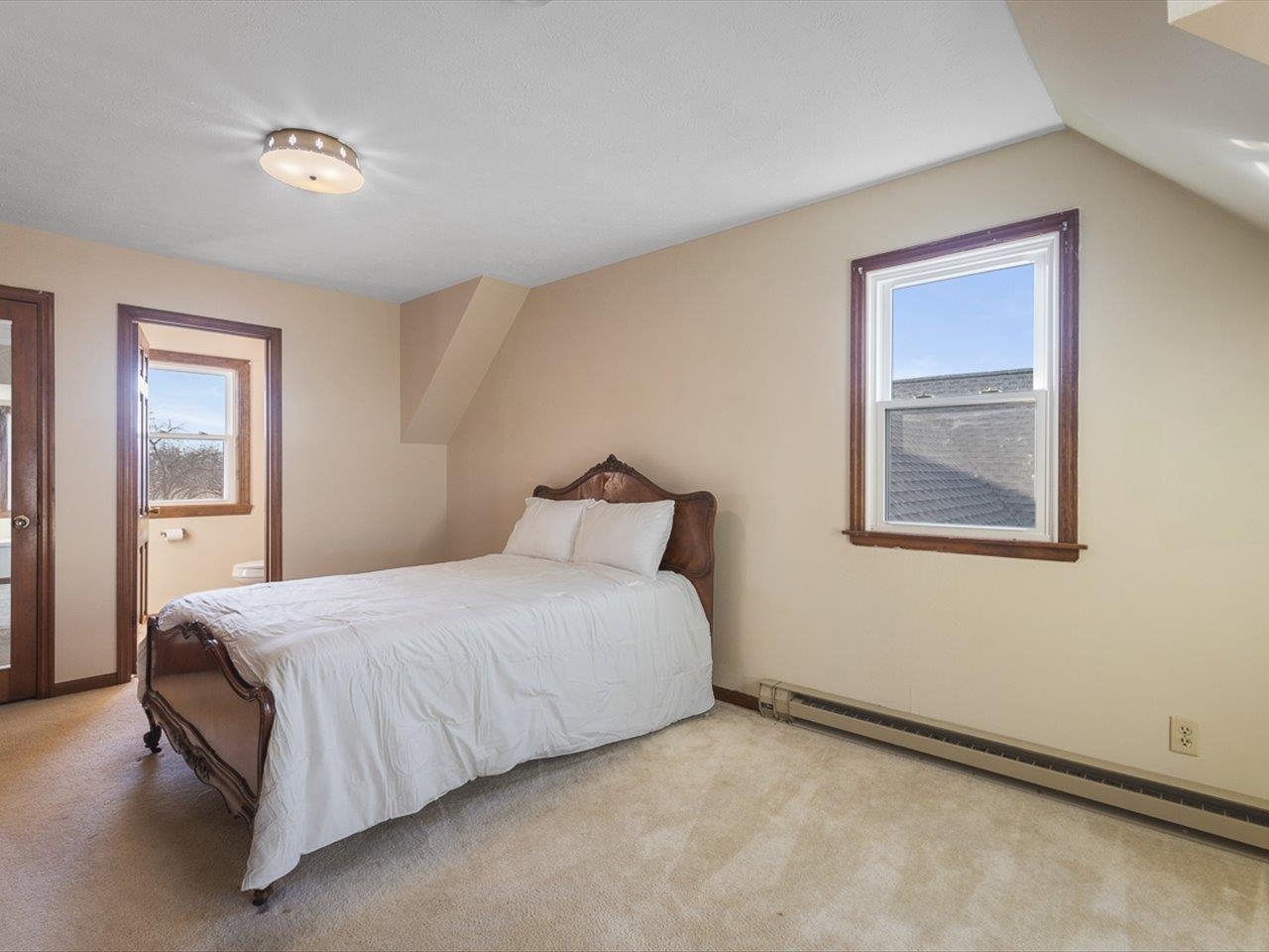 7101 Lawrenceville Road Garden Prairie, IL 61038 - Photo 29 of 53 a bedroom with a bed and windows