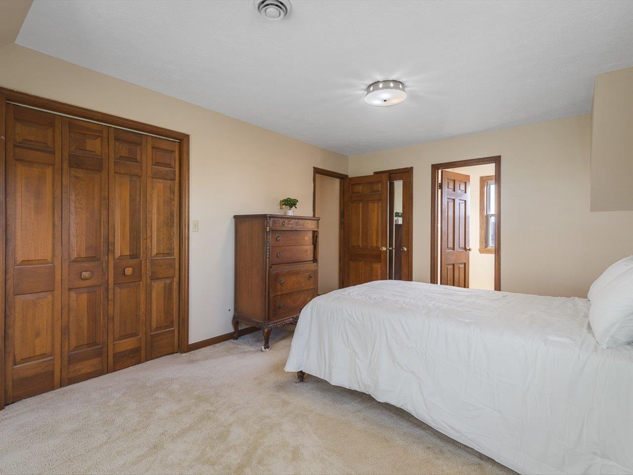 7101 Lawrenceville Road Garden Prairie, IL 61038 - Photo 30 of 53 a bedroom with a bed and a closet