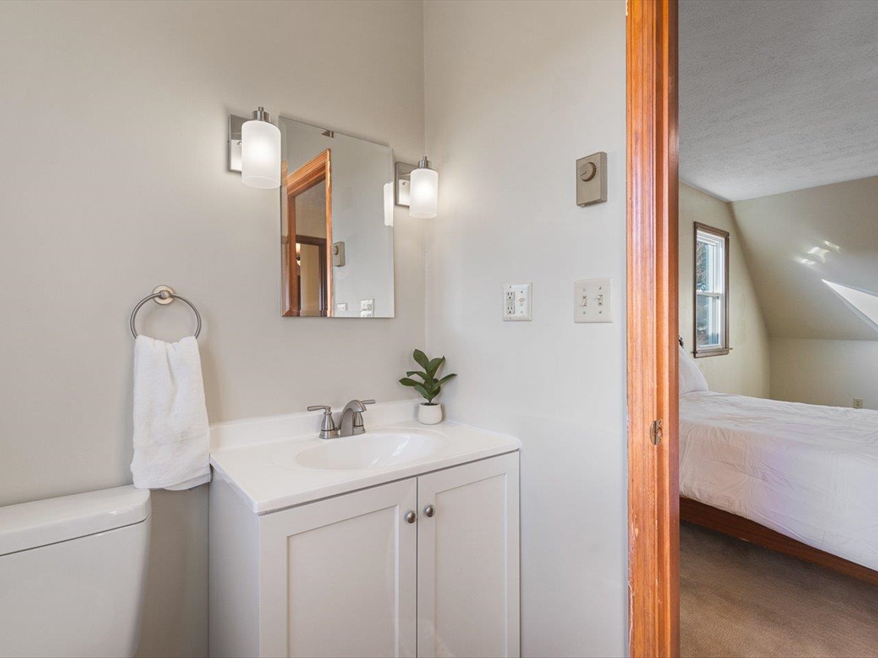 7101 Lawrenceville Road Garden Prairie, IL 61038 - Photo 32 of 53 a en suite bathroom with a sink and a mirror