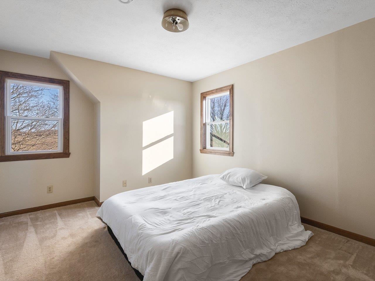 7101 Lawrenceville Road Garden Prairie, IL 61038 - Photo 33 of 53 a bedroom with a bed and a window