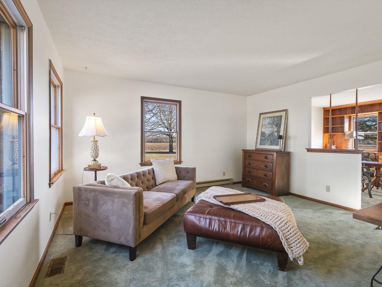 7101 Lawrenceville Road Garden Prairie, IL 61038 - Photo 7 of 53 a spacious bedroom with a bed a couch and a window