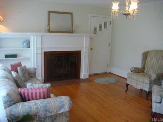 336 Meredith Street Raleigh, NC 27606 - Photo 4 of 12 Inviting living room feratures built-in bookshelves, firepalce, and hardwood floor Other