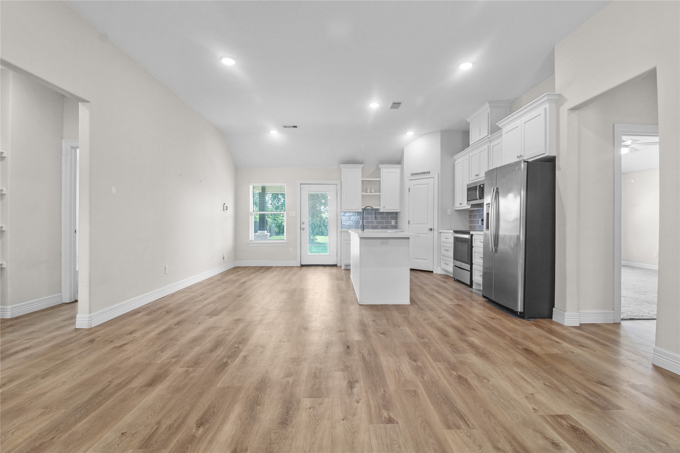 1208 East Henderson Road Angleton, TX 77515 - Photo 2 of 29 a view of kitchen view wooden floors appliances and cabinets