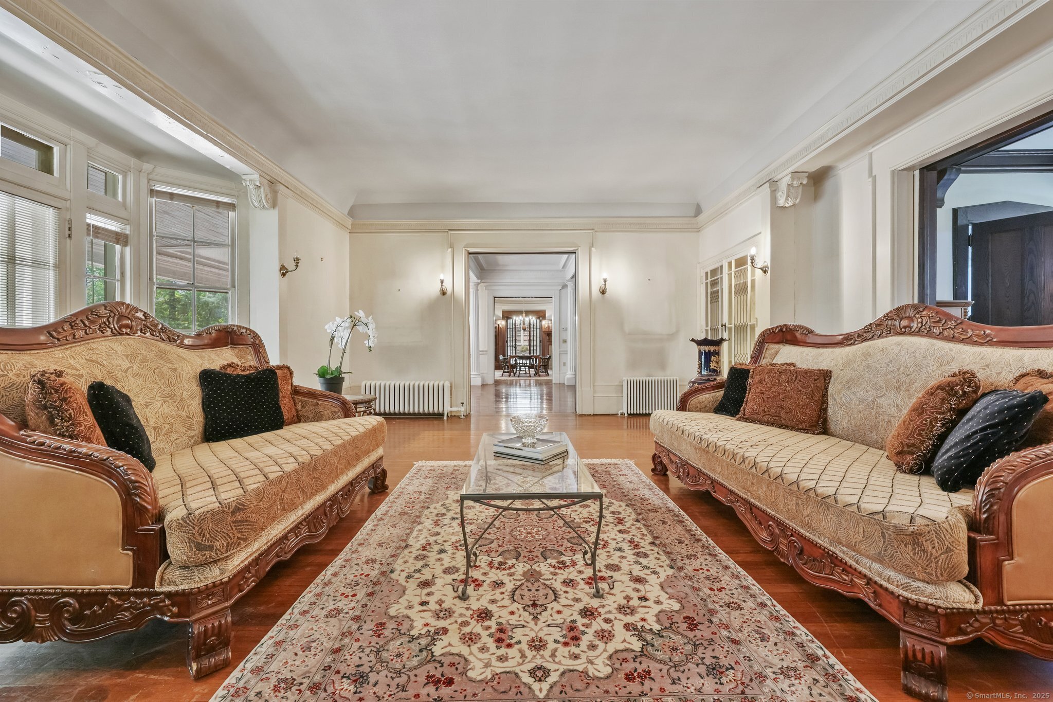 26 Shady Lane Greenwich, CT 06831 - Photo 11 of 29 a bedroom with a large bed and a couch