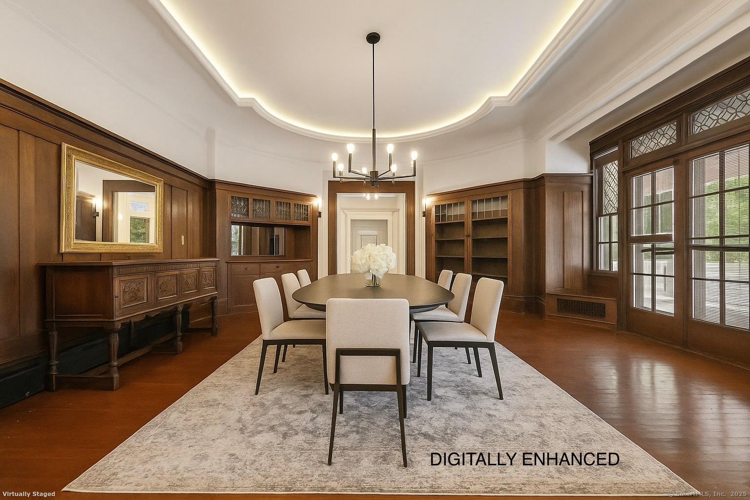 26 Shady Lane Greenwich, CT 06831 - Photo 13 of 29 a dining room with wooden floor a chandelier a wooden table and chairs