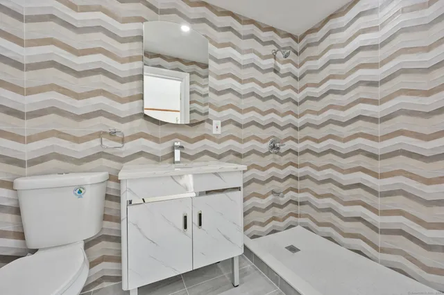 a view of an empty room with a fireplace