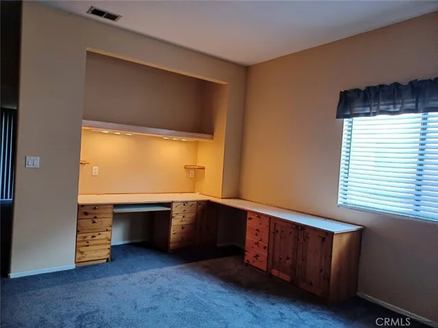 a room with furniture and a window