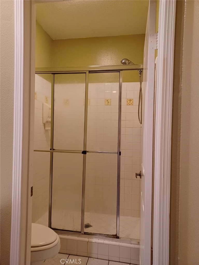 2018 Villa Del Lago Drive, Unit A Chino Hills, CA 91709 - Photo 6 of 10 a bathroom with a glass shower door