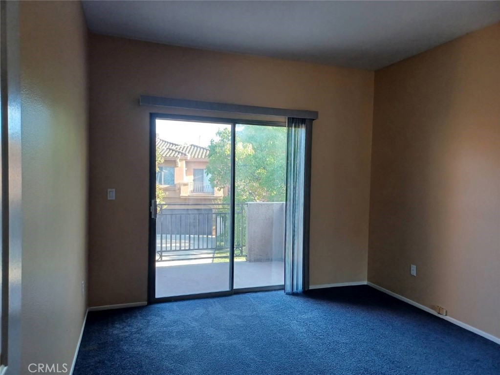2018 Villa Del Lago Drive, Unit A Chino Hills, CA 91709 - Photo 8 of 10 a view of an empty room with wooden floor and a window