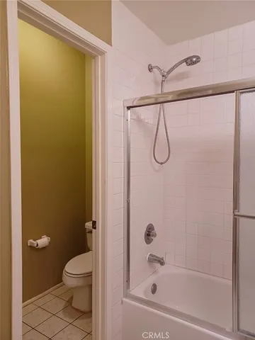 a bathroom with a shower and a toilet