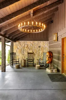 a dining room with furniture window and wooden floor
