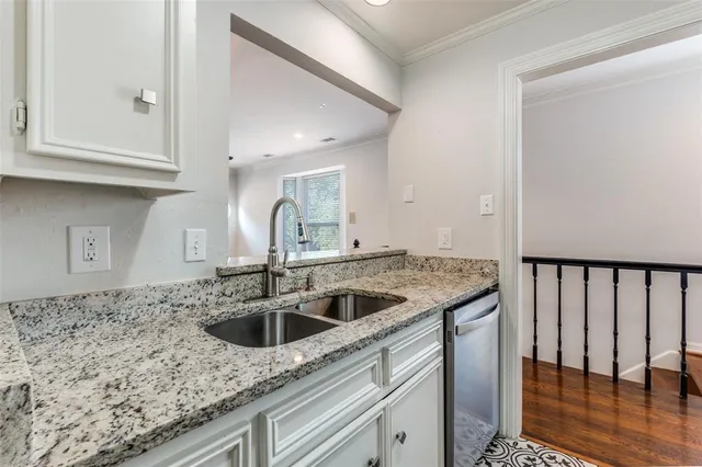 a kitchen with a sink and cabinets