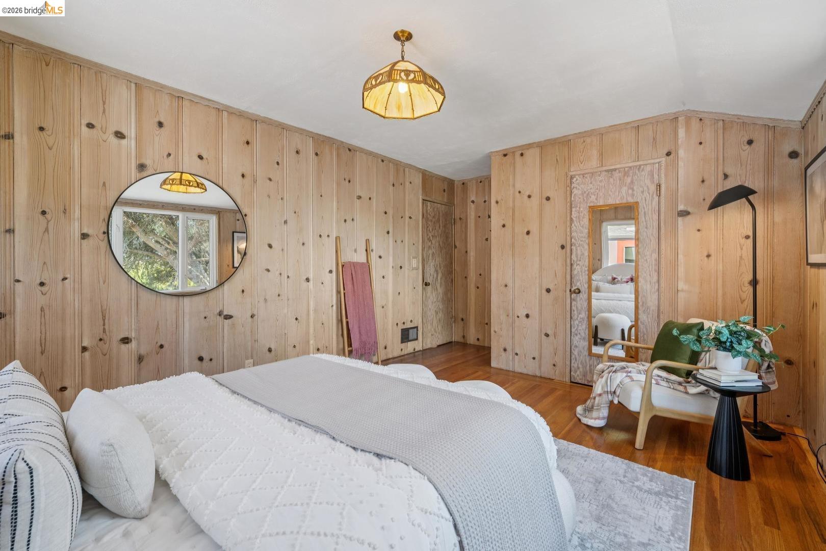 155 Avenida Drive Berkeley, CA 94708 - Photo 42 of 86 Wood paneling throughout, hardwood flooring, and a glass-paned window