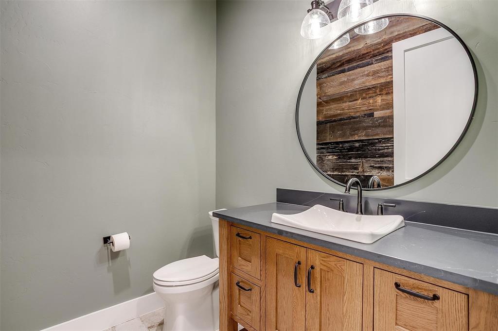 3019 Orchard Road Bowie, TX 76230 - Photo 25 of 40 a bathroom with a sink and a mirror