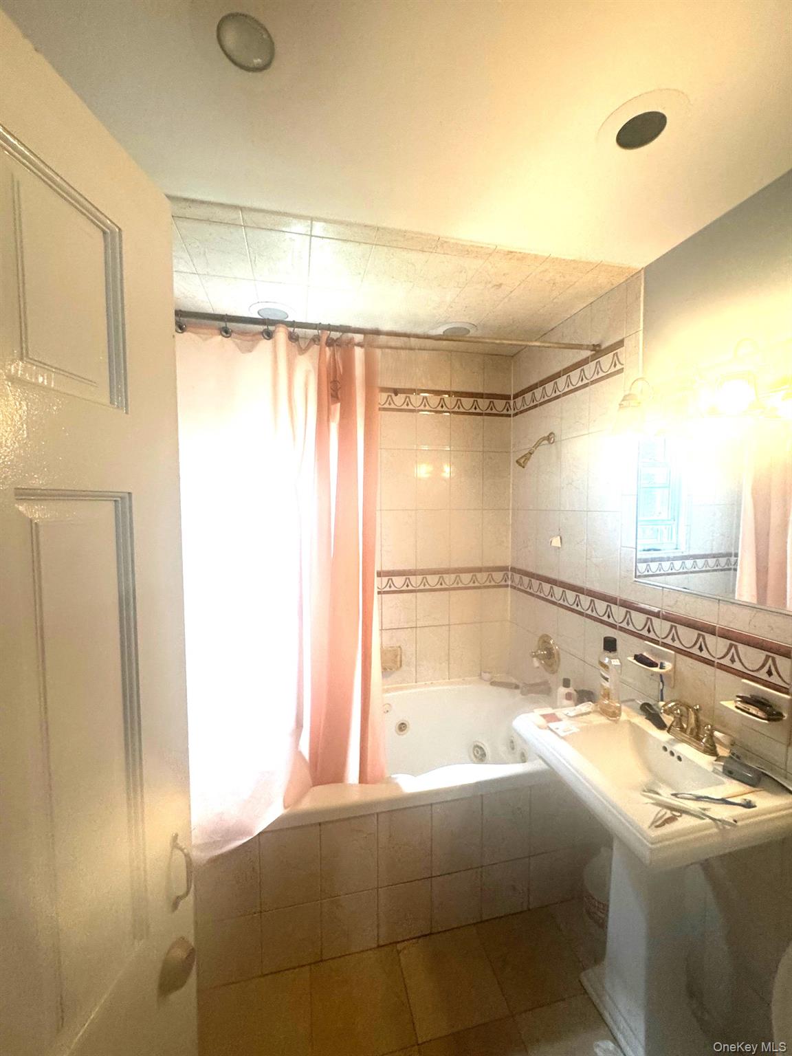 2339 Barnes Avenue Bronx, NY 10467 - Photo 15 of 16 a bathroom with a bathtub and a shower