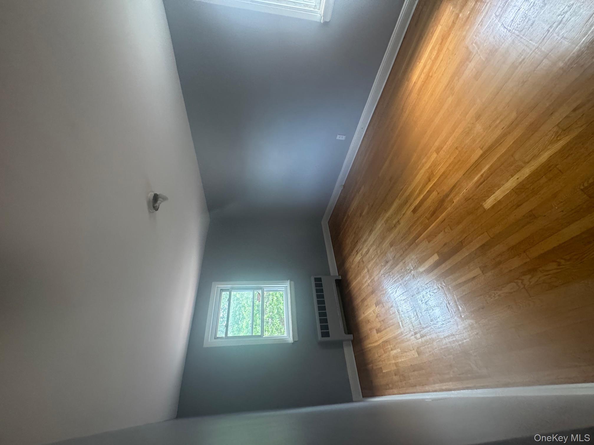 2339 Barnes Avenue Bronx, NY 10467 - Photo 16 of 16 an empty room with a window