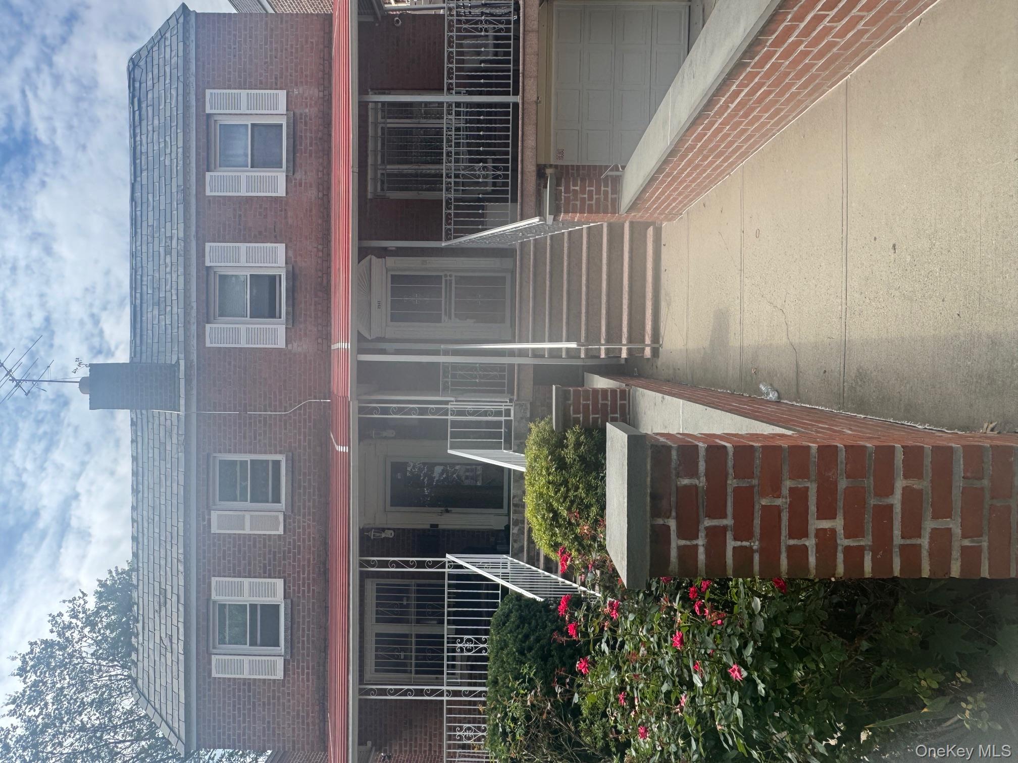 2339 Barnes Avenue Bronx, NY 10467 - Photo 6 of 16 a front view of a house with garden