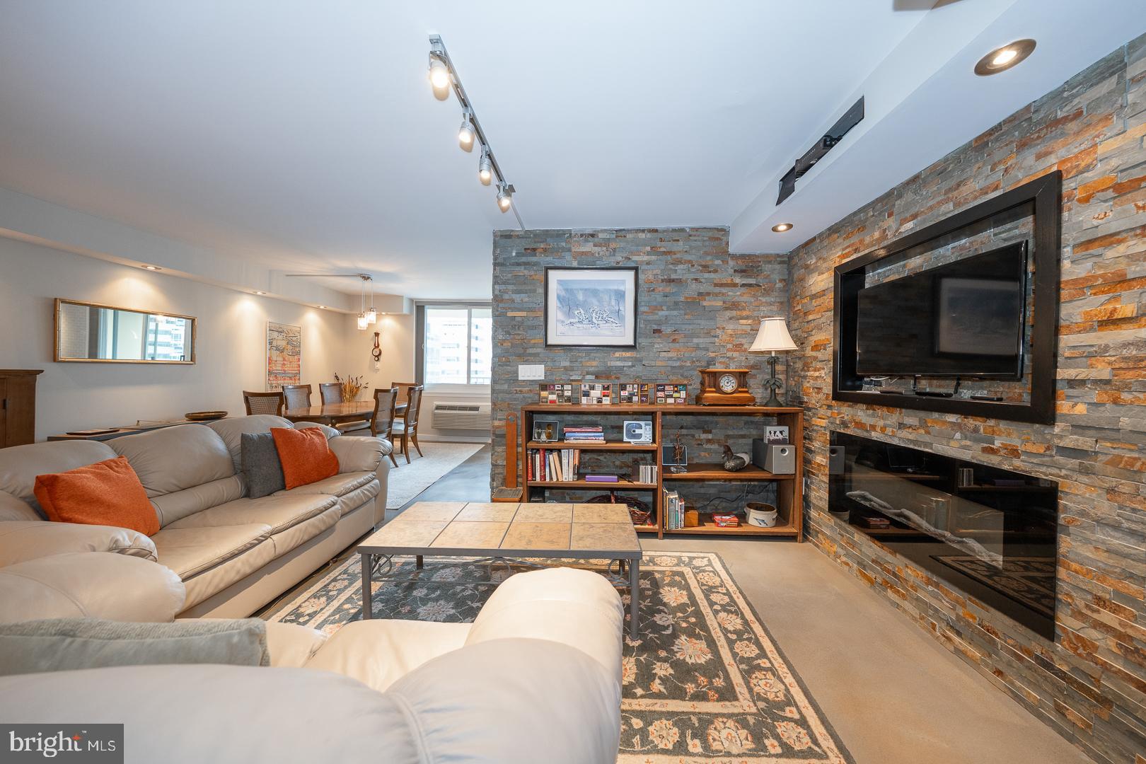1919 Chestnut Street, Unit 1919 Philadelphia, PA 19103 - Photo 1 of 27 a living room with furniture and a flat screen tv