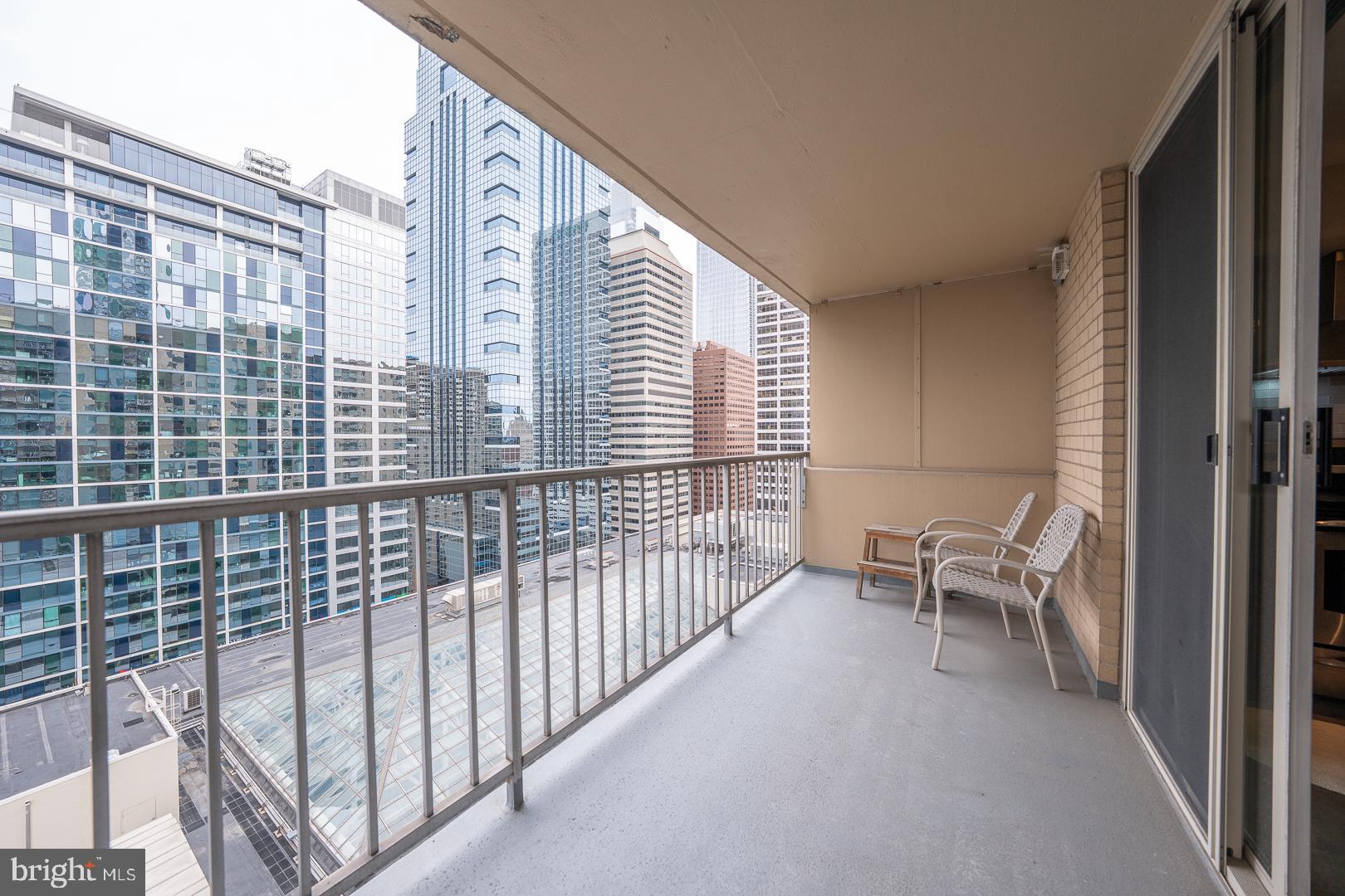 1919 Chestnut Street, Unit 1919 Philadelphia, PA 19103 - Photo 18 of 27 a porch with a bench