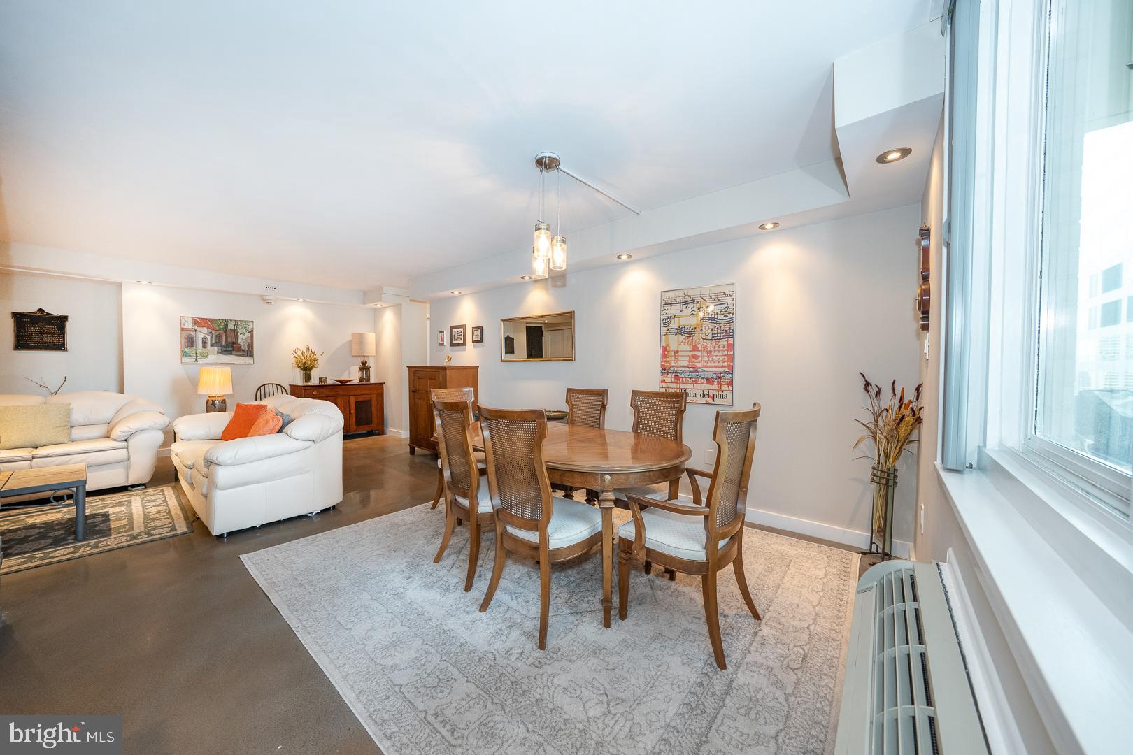 1919 Chestnut Street, Unit 1919 Philadelphia, PA 19103 - Photo 5 of 27 a living room with furniture and a large window