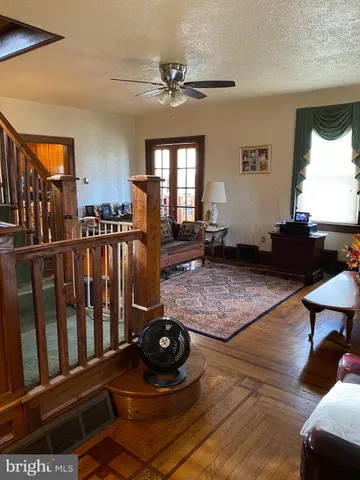 a living room with furniture and a rug