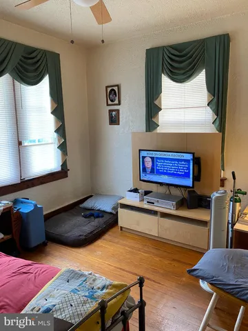 a bedroom with a bed and dresser