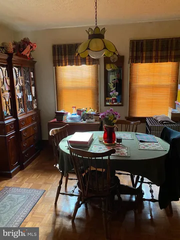 a view of a dining room with furniture and window