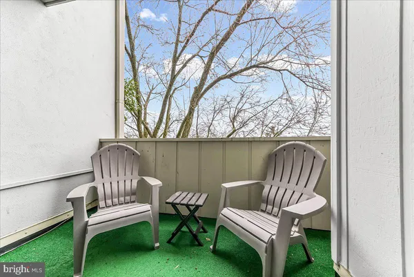 a wooden bench sitting in the middle of a yard