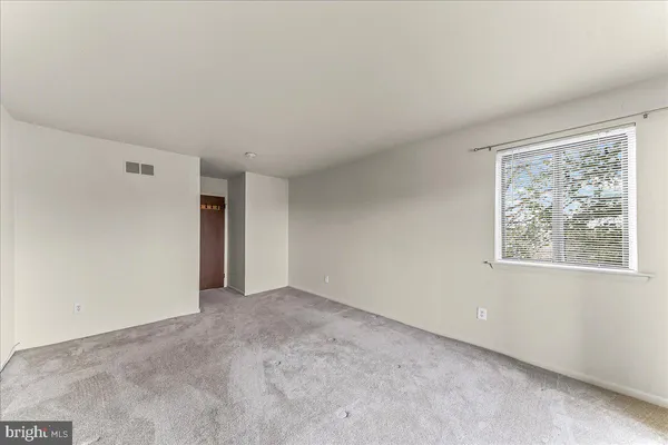 a view of wooden fence and flowers